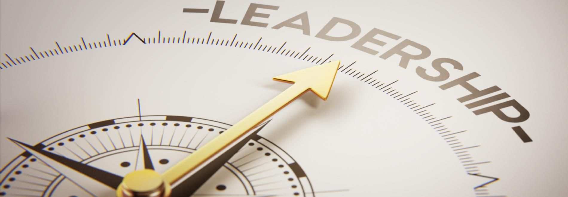 A compass pointing towards the word leadership