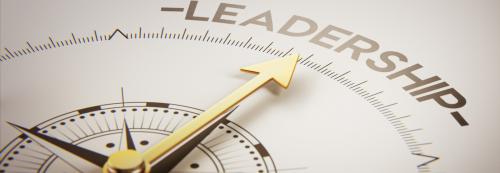 A compass pointing towards the word leadership