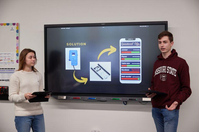 two students present their project