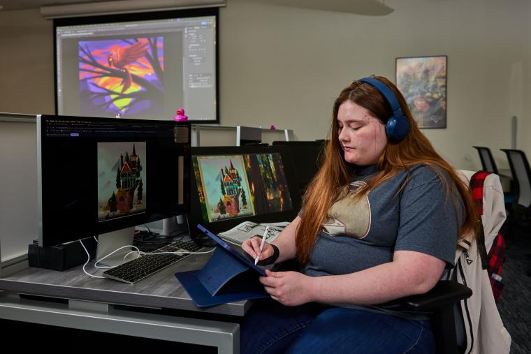 Student drawing on an Ipad