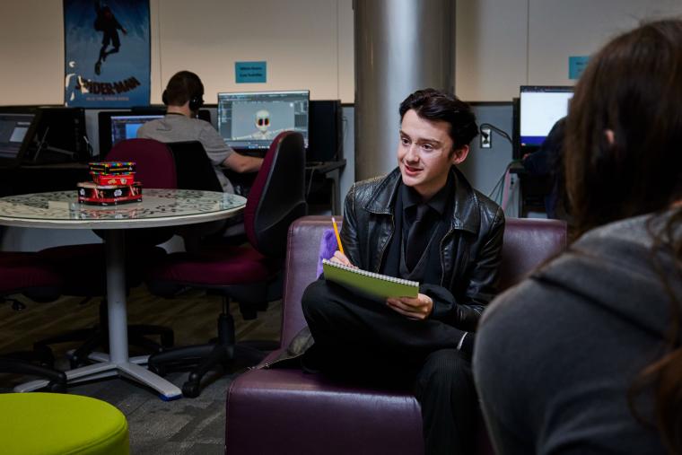 Student working on hand drawn sketch