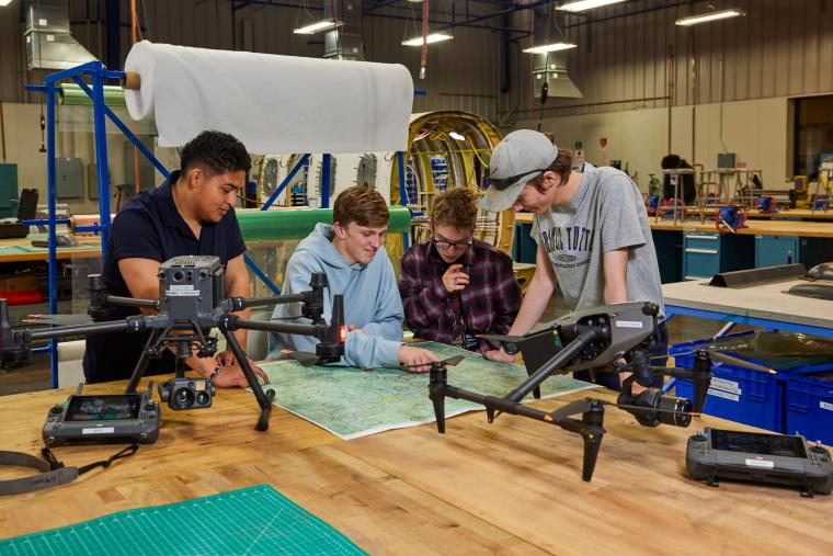 Several students reading aeronautical chart