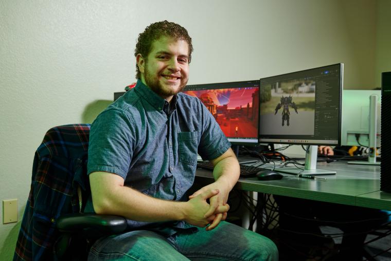 Student working on the level geometry in a video game