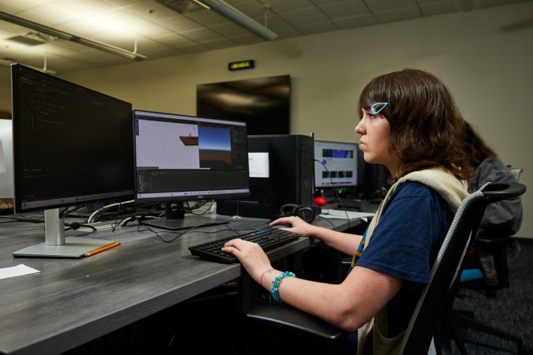 Student developing a video game