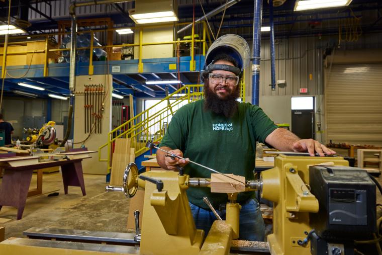 Student working on part in lathe
