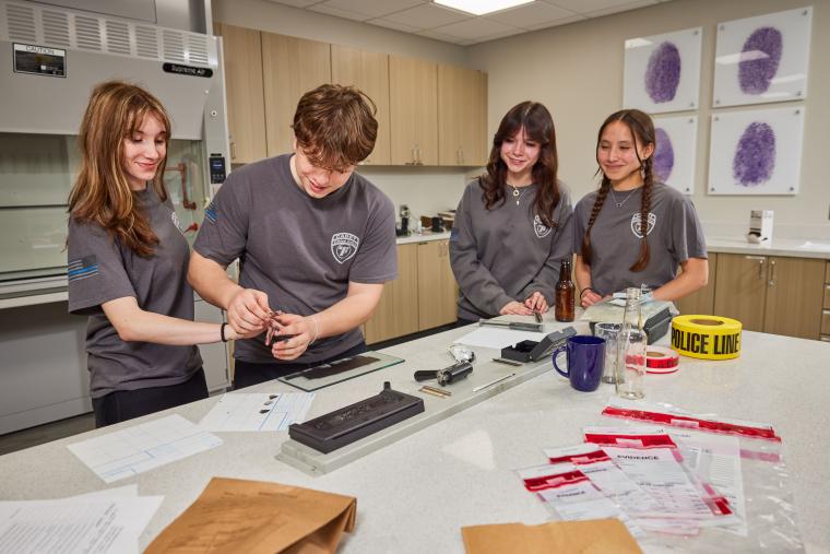 Several students taking fingerprint samples