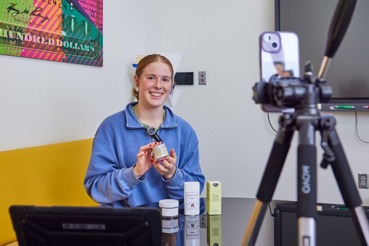 Student recording product showcase with smartphone