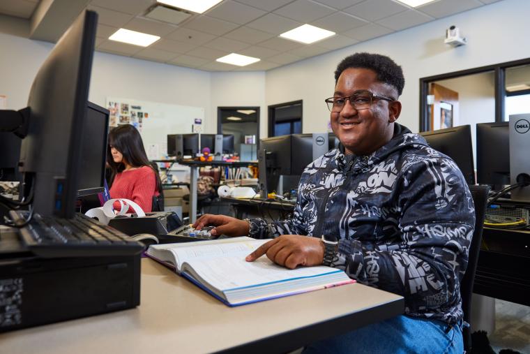 Student reading textbook