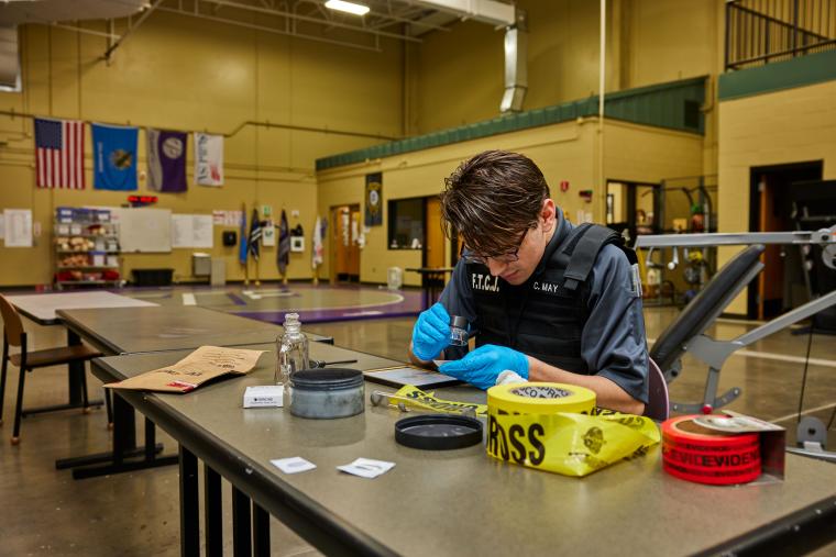 Student examining fingerprints