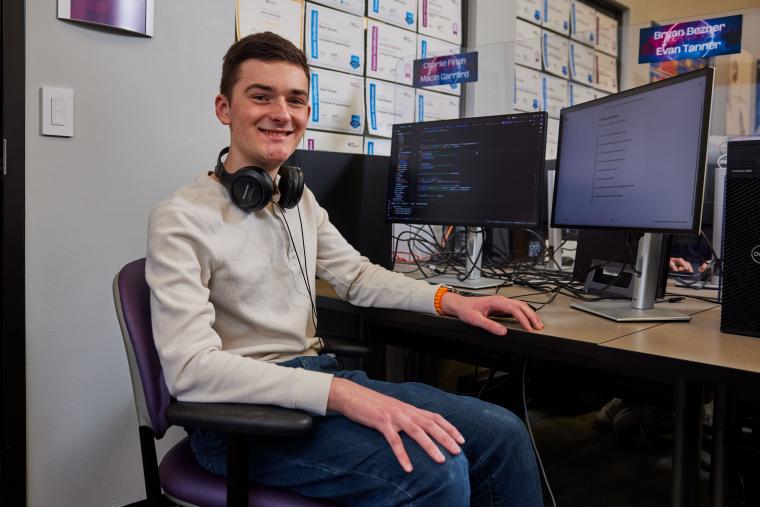 Student working through programming exercises