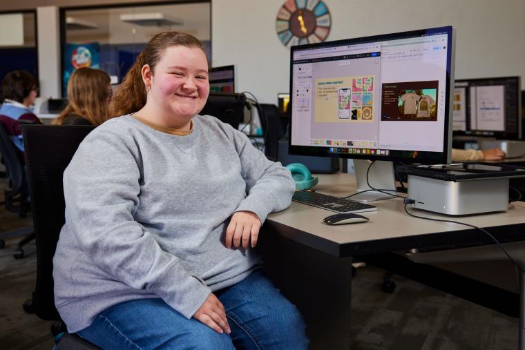 Student designing a brand guide
