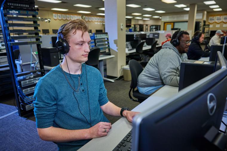 Student working in front of a desktop computer