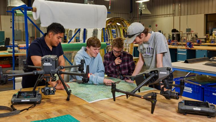 Several students reading aeronautical chart