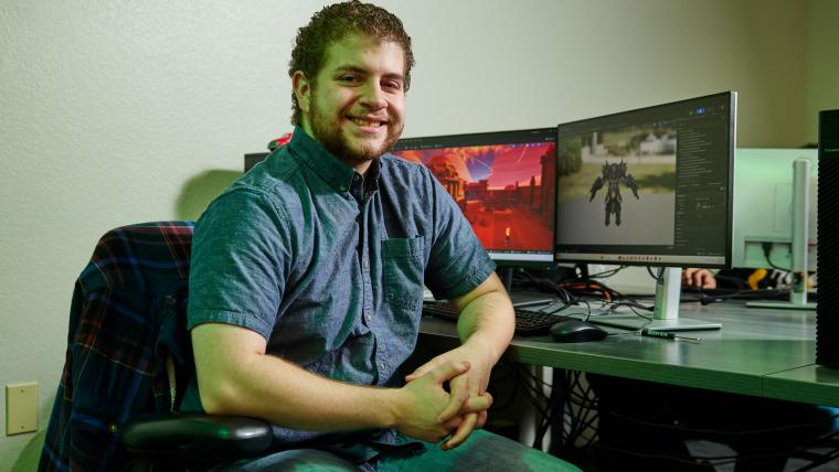 Student working on the level geometry in a video game