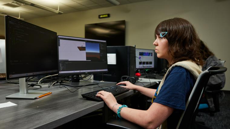 Student developing a video game