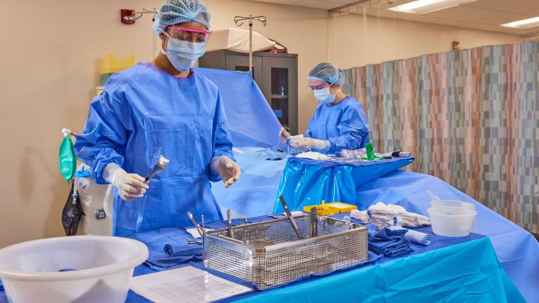 Two students preparing an operating room