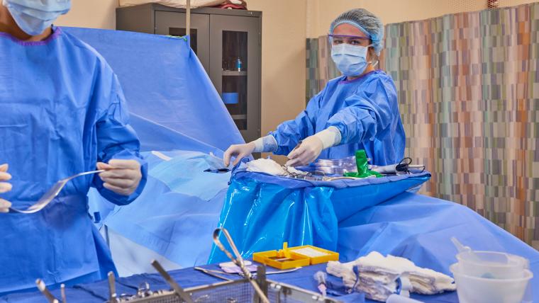 Two students preparing tools for an operation