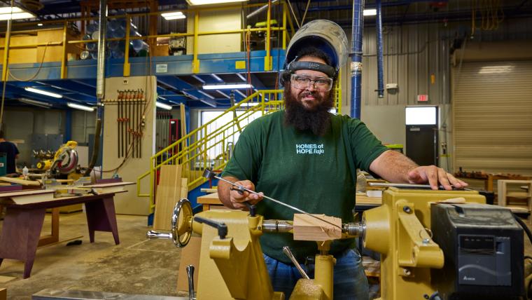 Student working on part in lathe