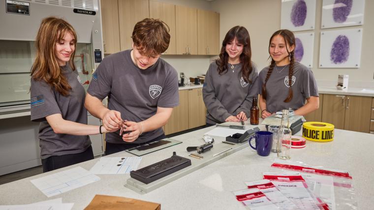 Several students taking fingerprint samples