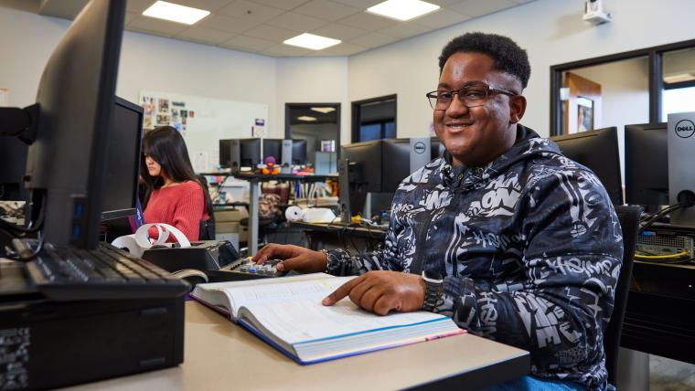 Student reading textbook