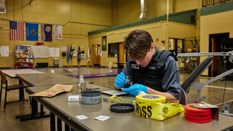 Student examining fingerprints