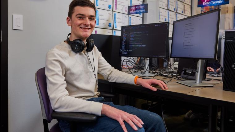 Student working through programming exercises