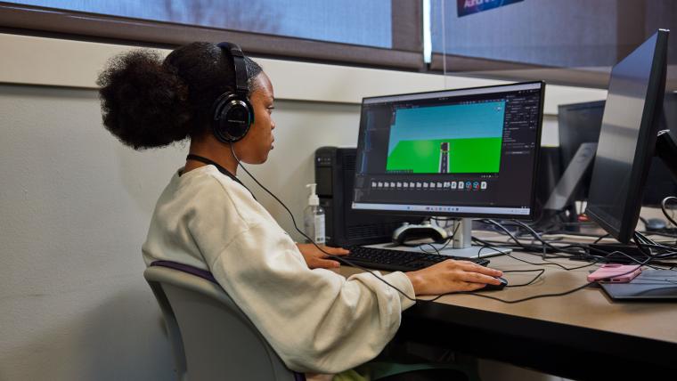Student developing a video game