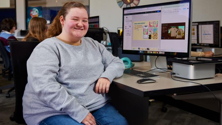 Student designing a brand guide