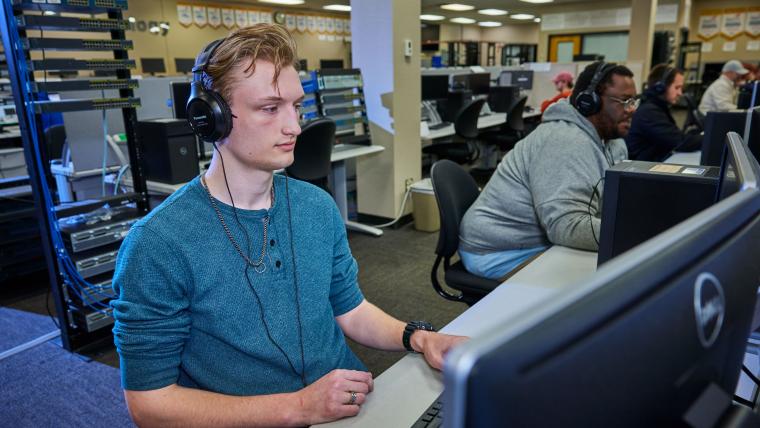 Student working in front of a desktop computer