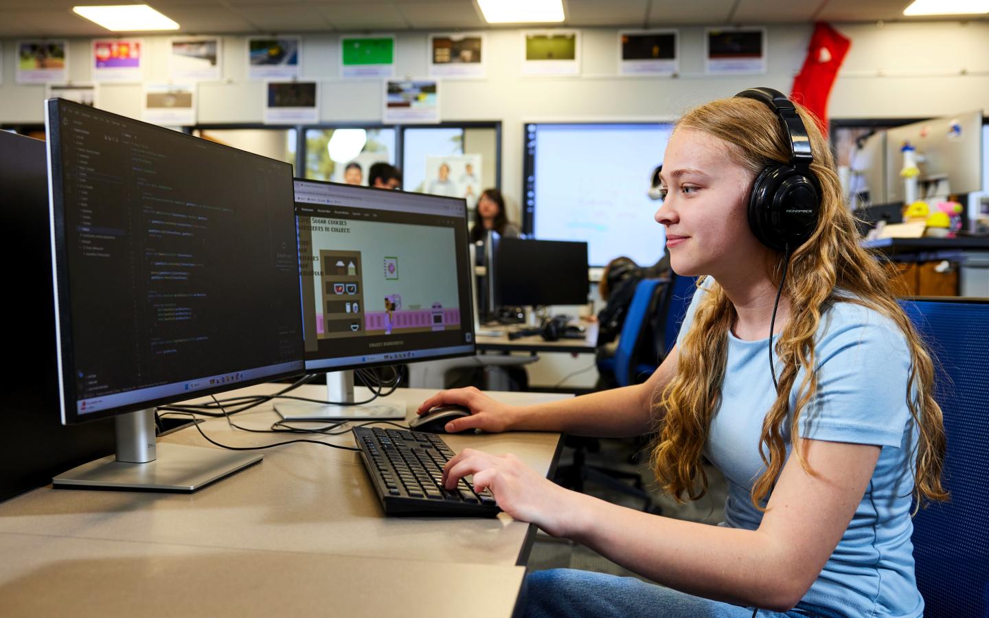 Female student coding on a computer.