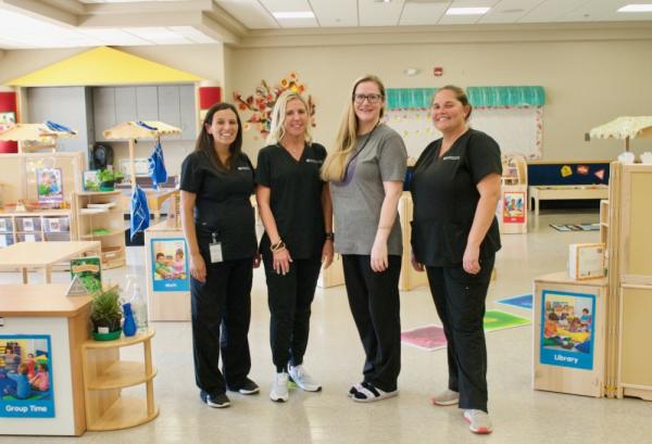 Group of child development center staff standing together