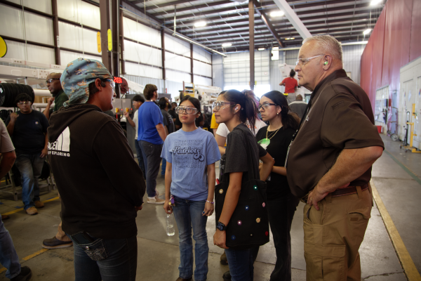 Francis Tuttle students chat with one of PALFINGER's female welders