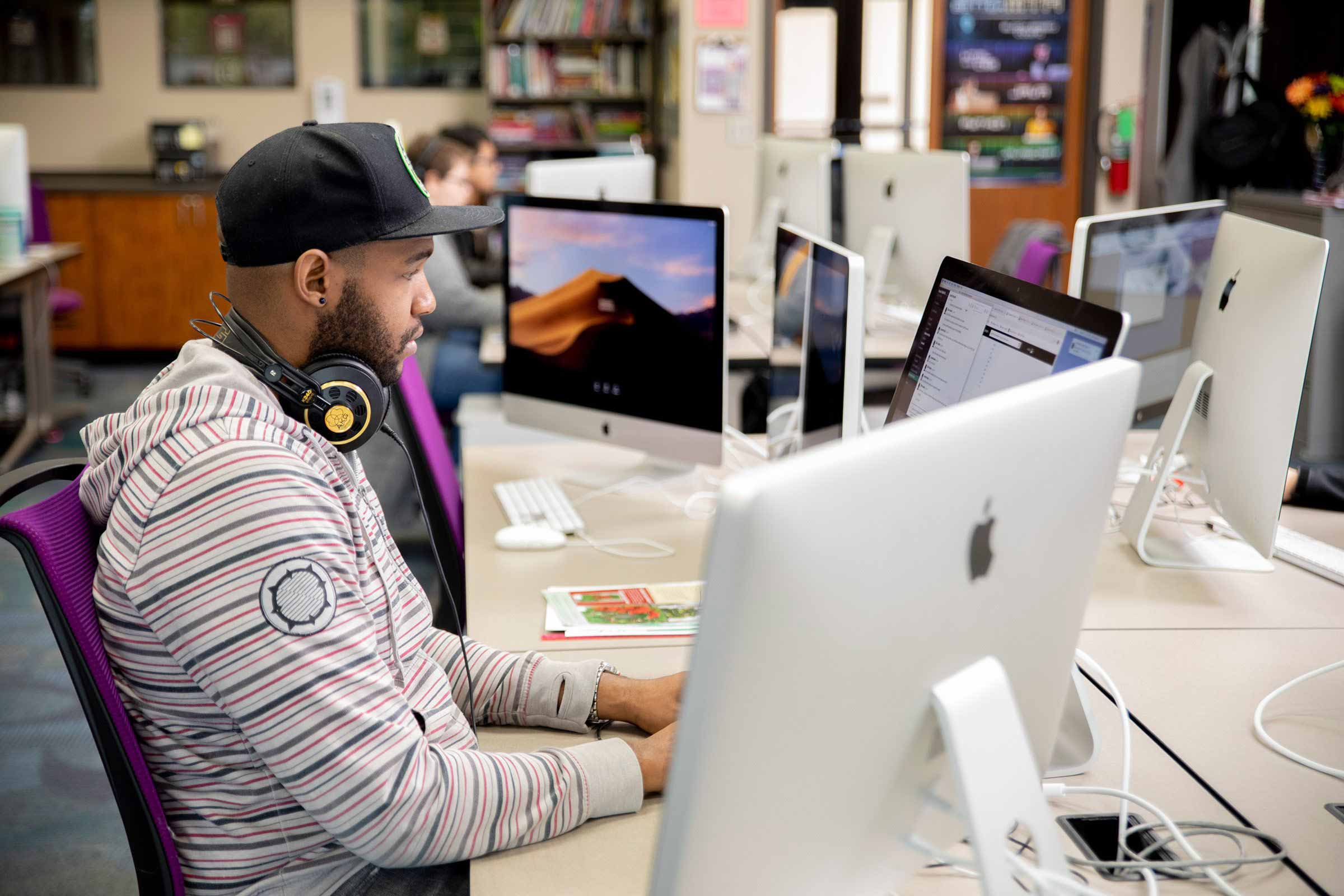 Student in a lab studying while listening to the music